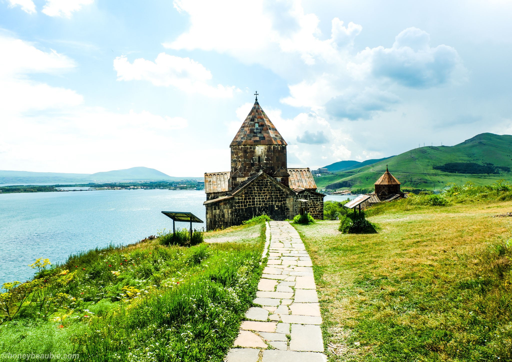 Landscape view of Sevanavank Monastery with Lake Sevan in the background.